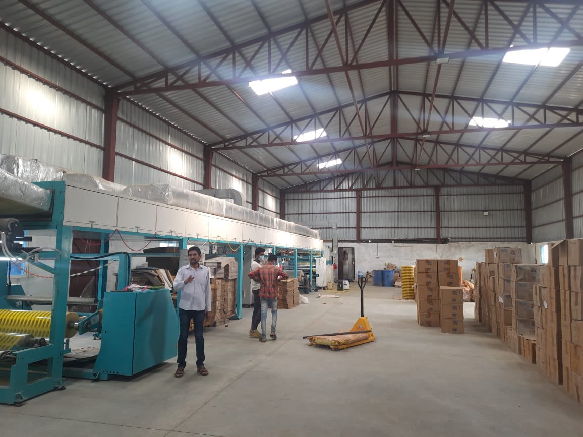 Workers handling adhesive tape production and packing